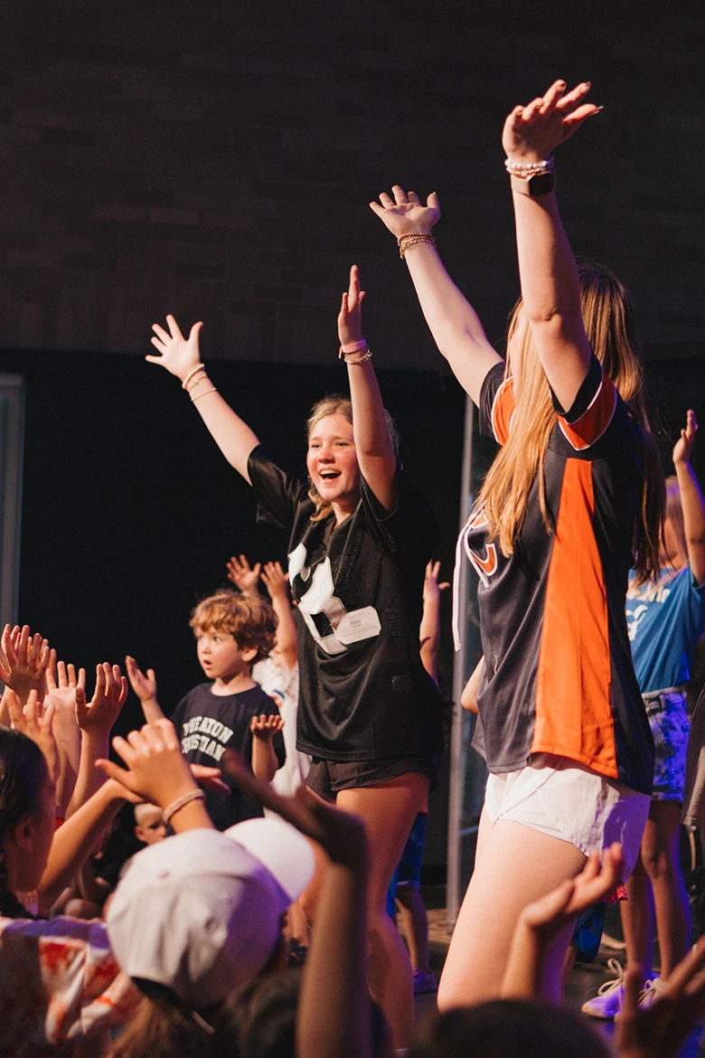 Group of girls sitting on grass smiling