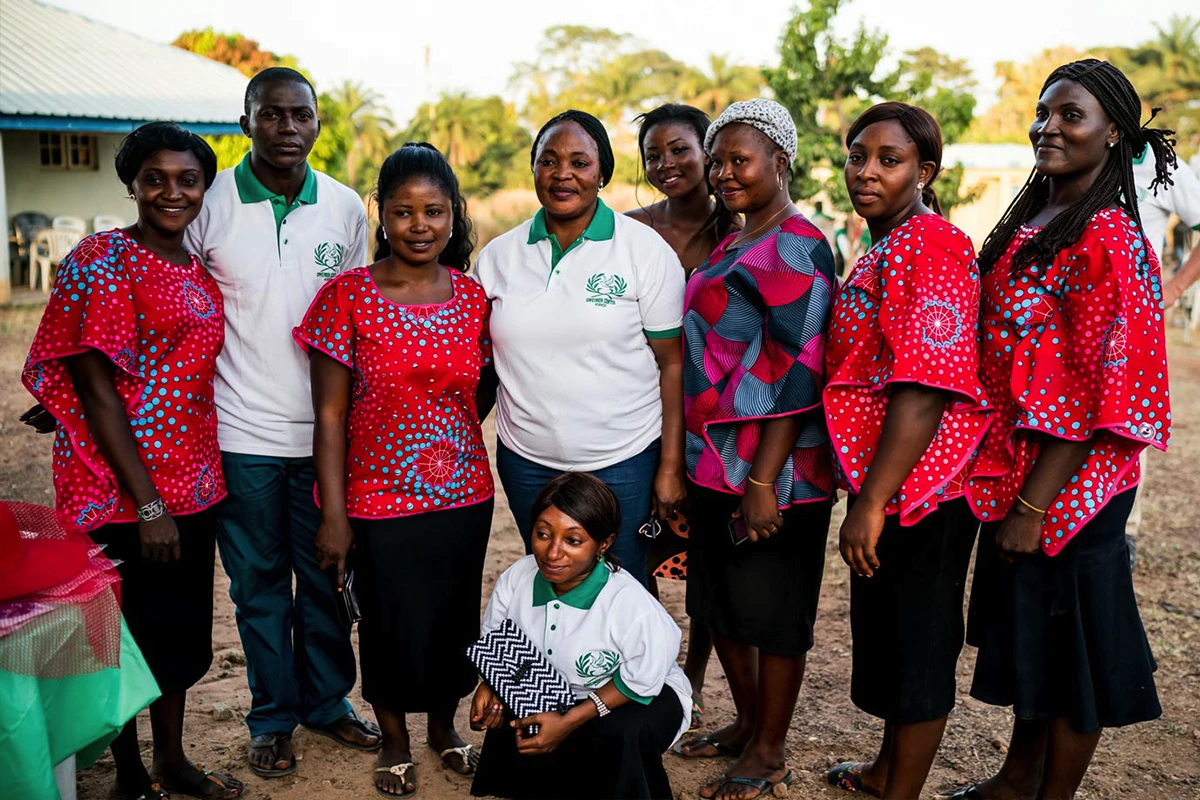 Young woman running a video camera.